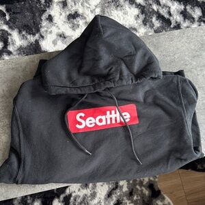 Black Hoodie with Red Seattle Logo